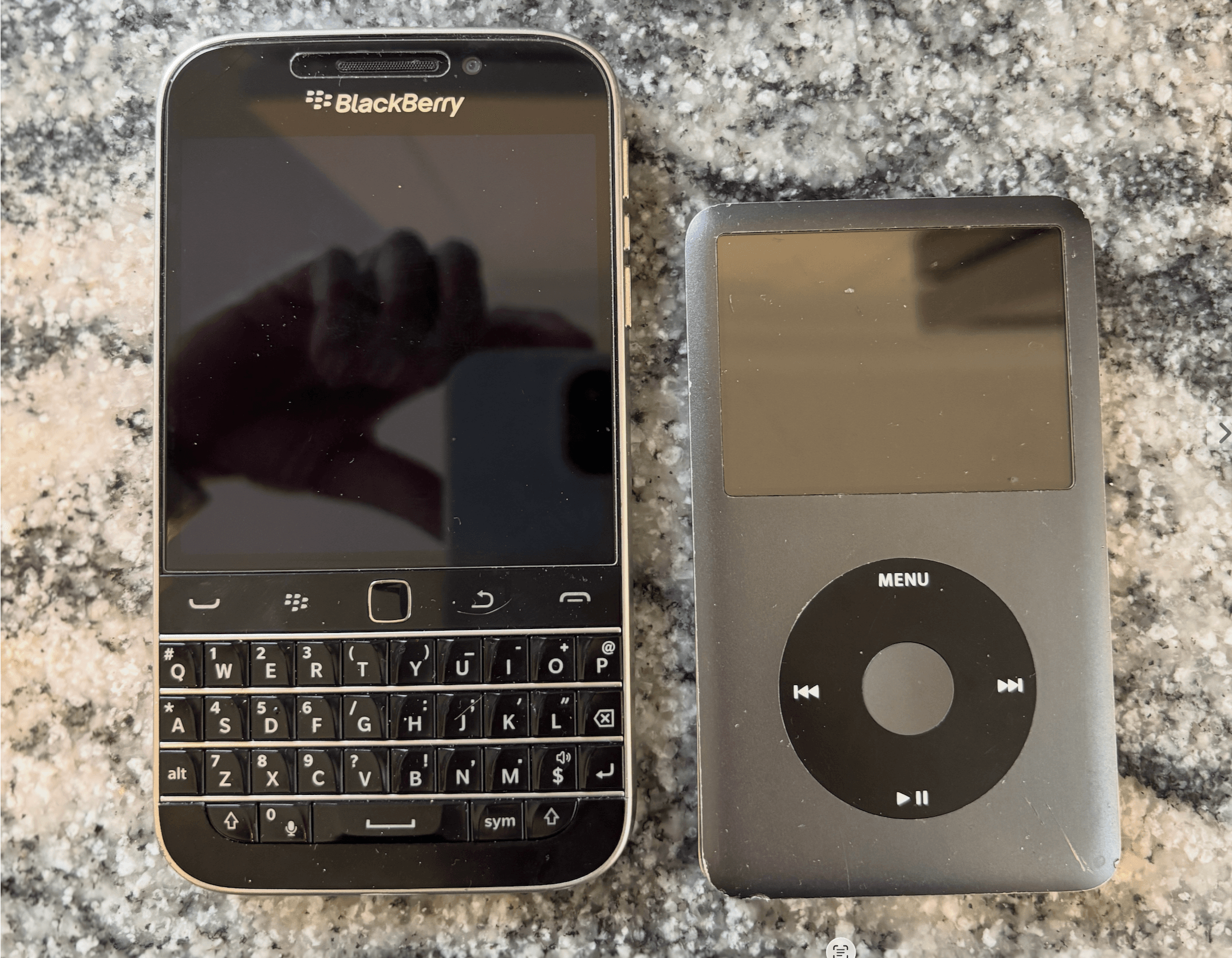 A Blackberry Classic next to an iPod Classic